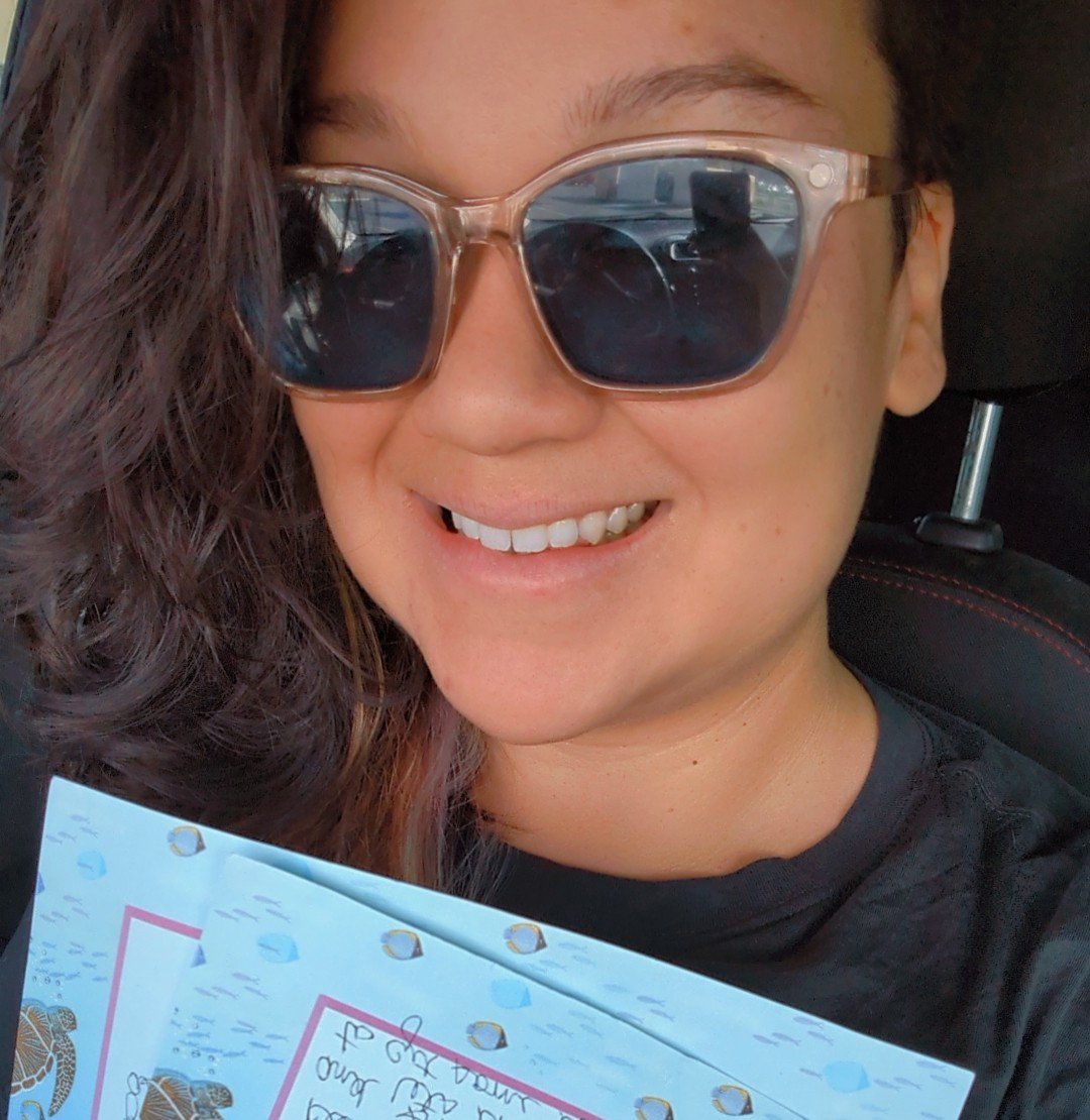 Jessica Jackson, founder of Barn Maids, holding a testimonial letter from satisfied clients